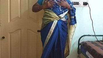 A Lusty Indian Wife In A Blue Saree Flaunts Her Big Tits And Shaved Pussy, Rubbing Her Nipples And Fingering Herself Hard.