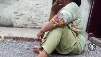 Desi Pakistani Aunty Puffing On A Cigarette With Raw Desire